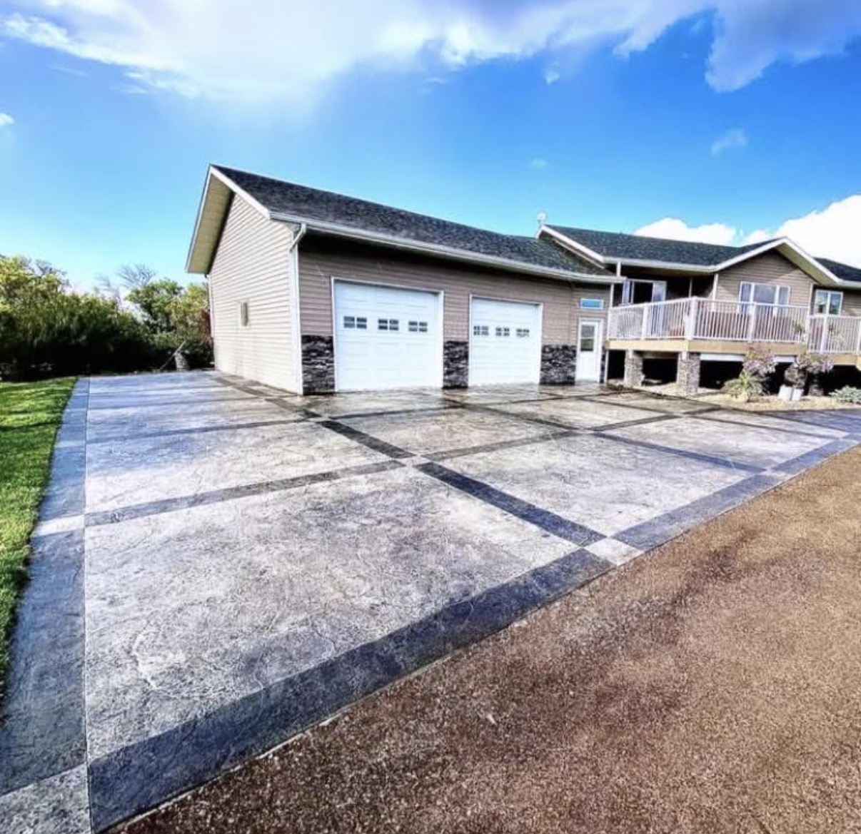 Custom stamped concrete driveway with banded border in Saskatchewan